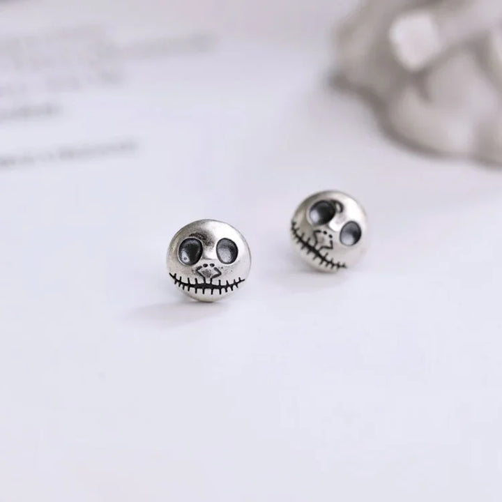 Handcrafted women's jewelry: Pumpkin skull earrings with intricate design, ideal for Halloween or unique style.