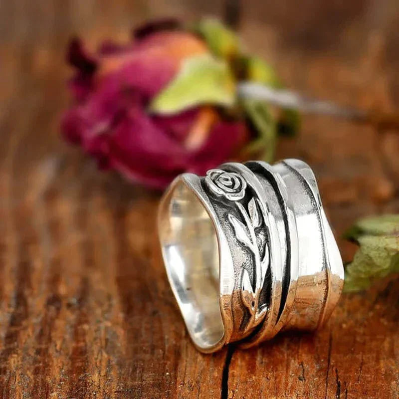 Women's unique handmade sterling silver flower ring featuring a delicate lilac floral motif. Elegant jewelry gift.