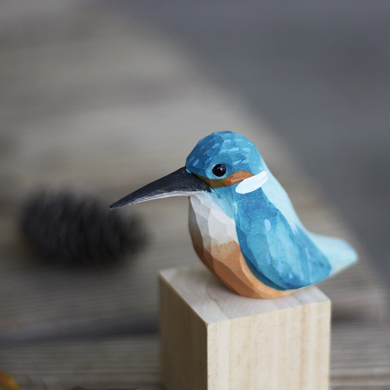 Exquisite carved wood bird figurines, handcrafted artisan decor for any home.