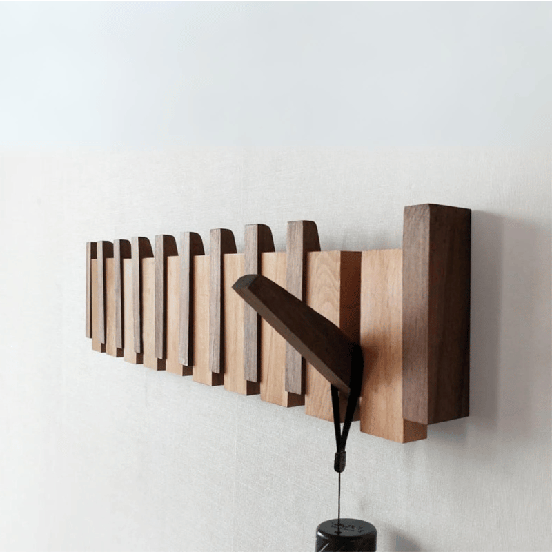 Handmade wooden coat rack with 5 foldable hooks. Perfect entryway organizer for jackets, hats & bags. Space-saving.