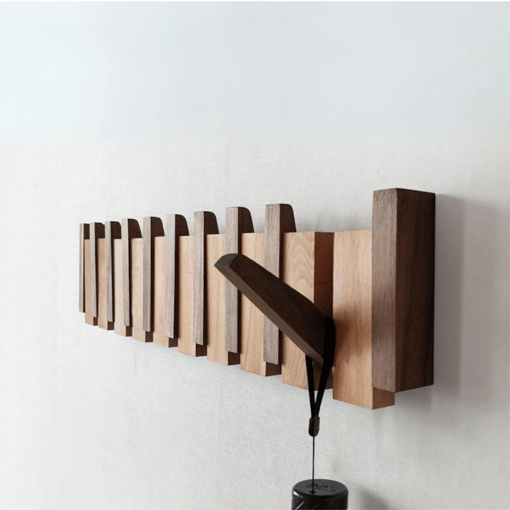 Handmade wooden coat rack with 5 foldable hooks. Perfect entryway organizer for jackets, hats & bags. Space-saving.