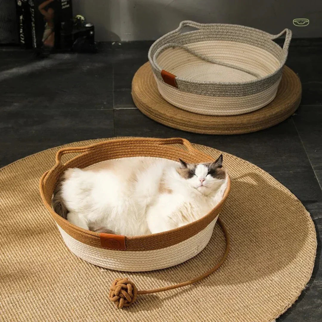 Handwoven grey cotton rope cat bed, a cozy and modern pet furniture piece for feline comfort.