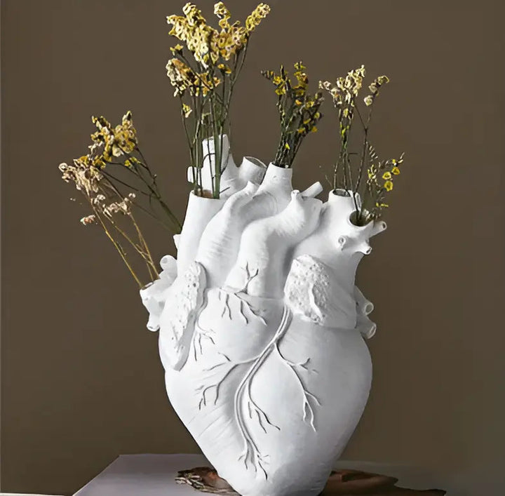 Decorative resin vase, heart-shaped with Greek decor, ideal for shelves or table accent.