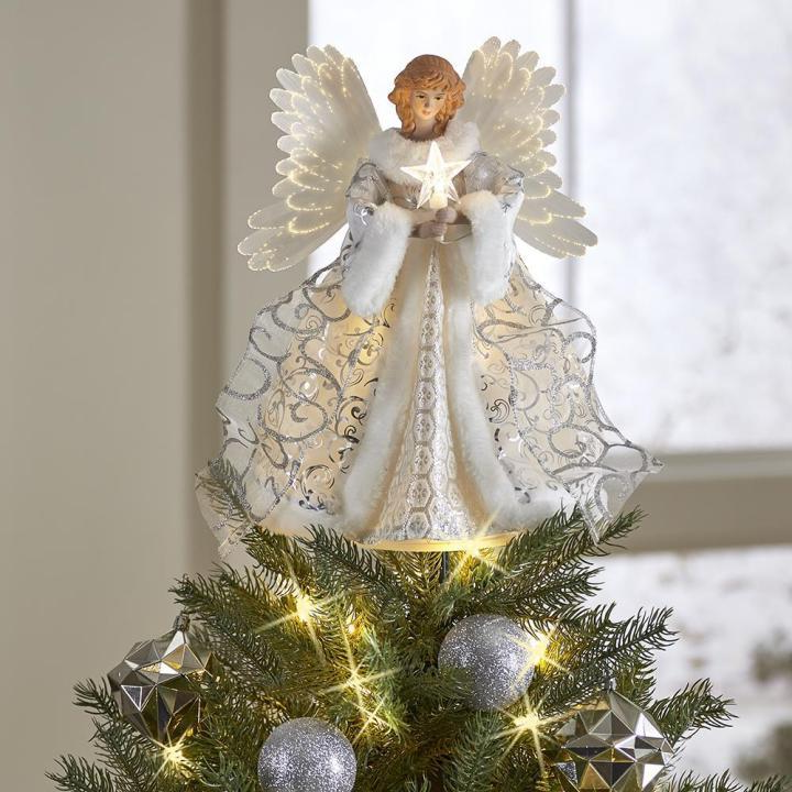Heavenly animated angel Christmas tree topper, festive holiday decor providing a celestial glowing accent.