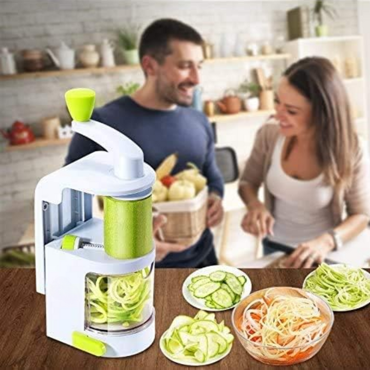 User making zucchini noodles with a 4-in-1 vegetable spiralizer, ideal for healthy meal prep.
