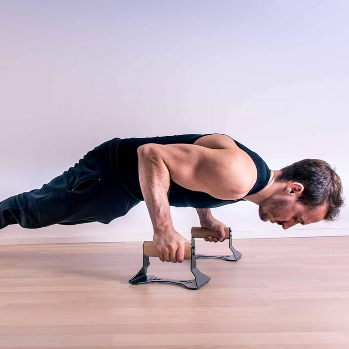Ergonomic wooden push-up handles for comfortable strength training. Enhance your bodyweight workout and home gym routine.