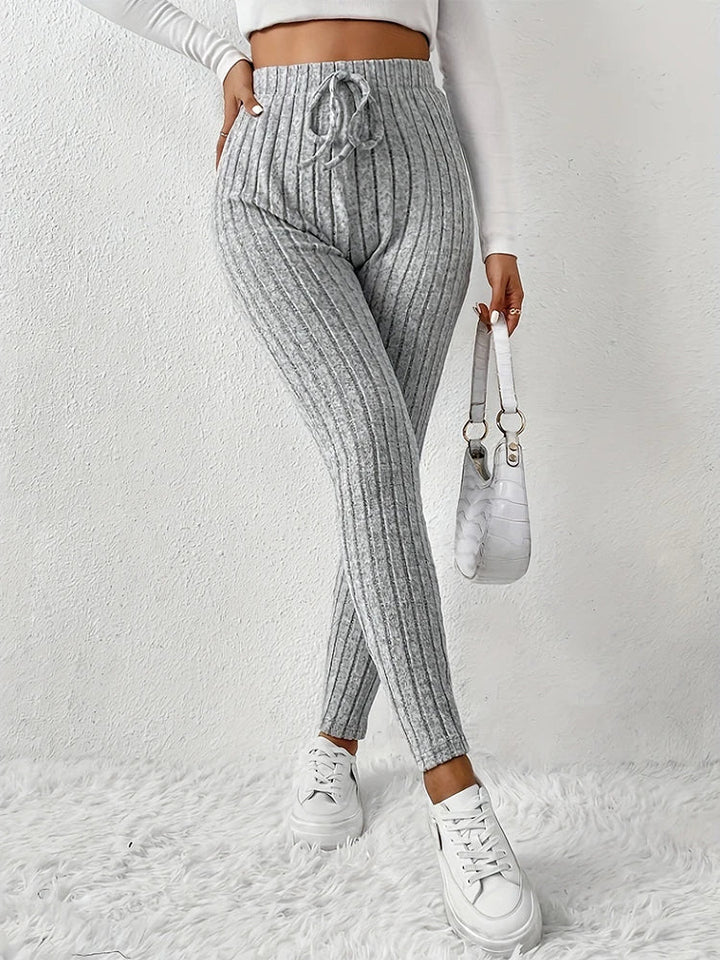 Comfortable high-rise ribbed leggings, perfect for casual wear, lounging, or light athletic activities.