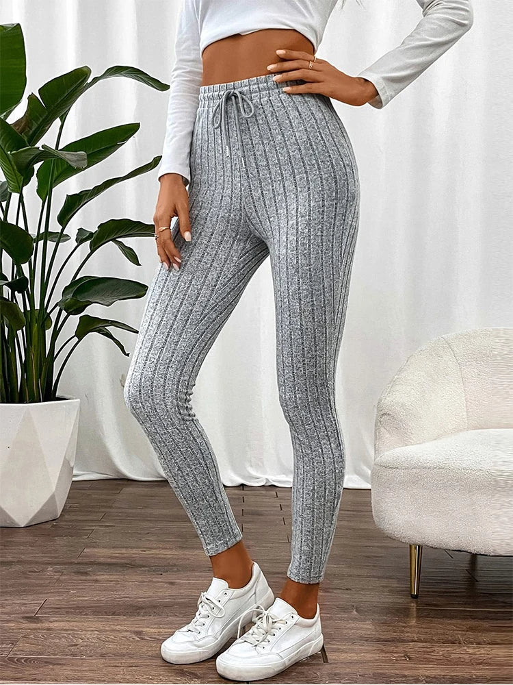 Soft, stretchy high-rise ribbed lounge pants for women, designed for all-day comfort and a slim fit.