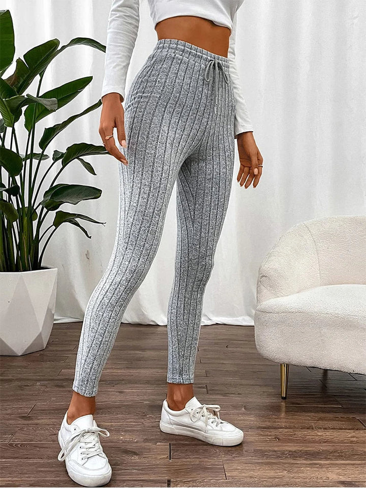 Modern high-rise ribbed athletic wear leggings for women, blending style, stretch, and comfort seamlessly.