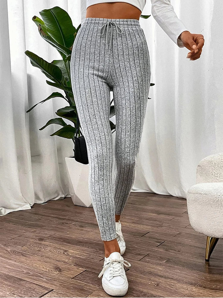 Women's high-rise ribbed leggings with an adjustable waist for a custom, comfortable, and slim fit.