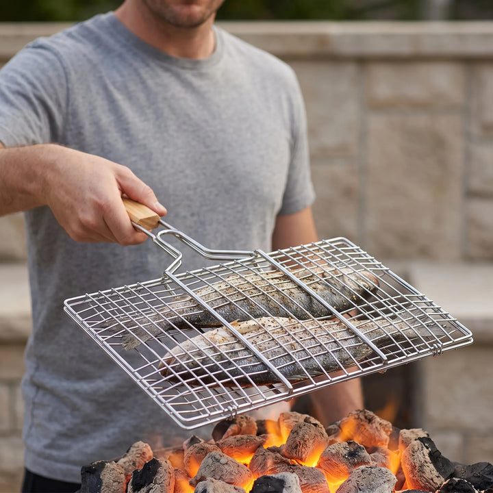 Hinged outdoor grilling basket for BBQ, perfect for easy flipping fish, vegetables, or meats on the grill.