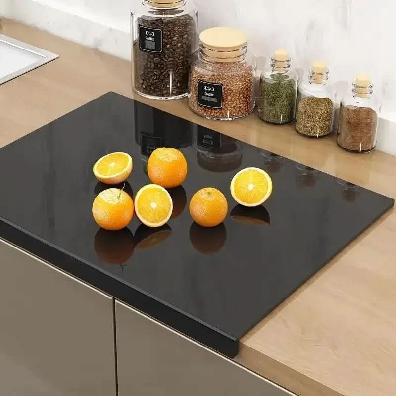 Household acrylic cutting board with protective lip, ideal for kitchen prep & countertop protection.