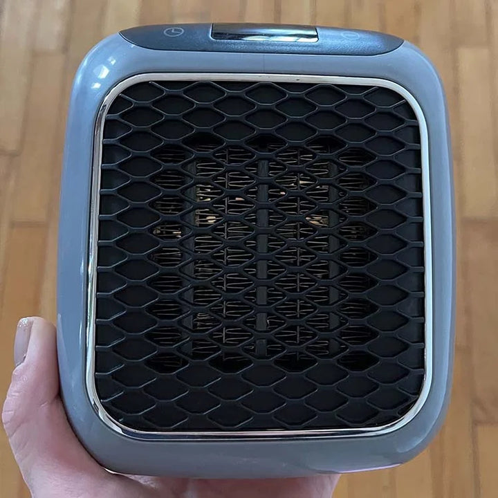 Person placing a Hulvio portable heater, emphasizing its ease of use and compact size