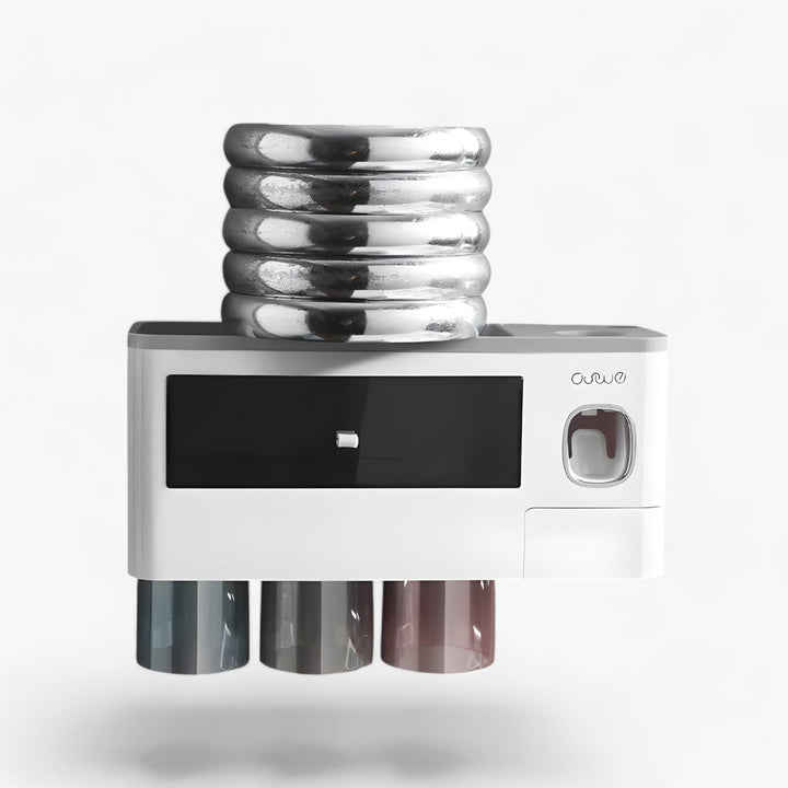 Close-up of HygiaHolder wall-mounted toothbrush holder, showing dispenser mechanism.