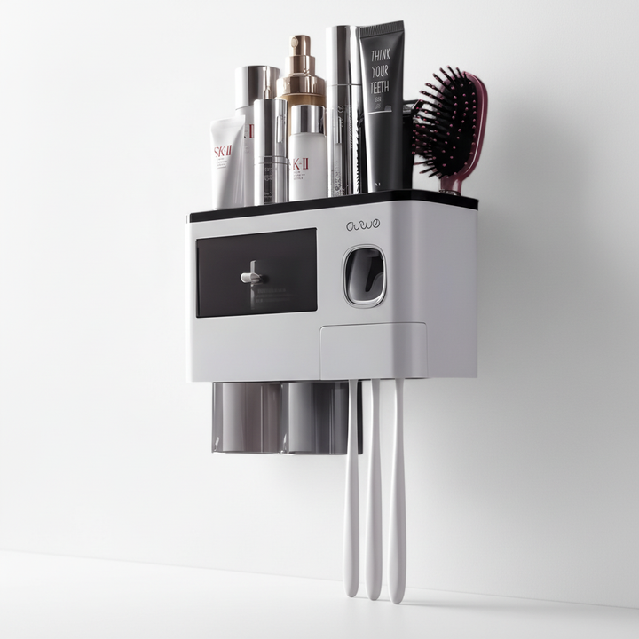 HygiaHolder toothbrush holder and automatic dispenser, white, mounted on a bathroom wall.