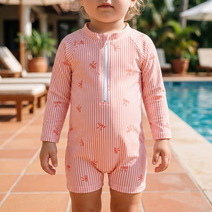 Infant long-sleeve rash guard swim set with UPF 50+ sun protection hat for baby's beach & pool days.