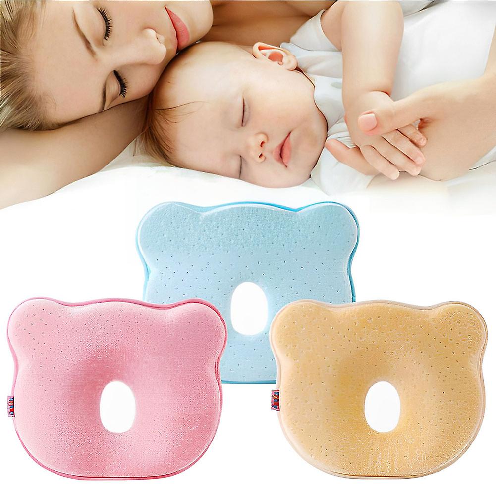 Infant memory foam pillow, ergonomic head support for newborns, preventing flat head syndrome.