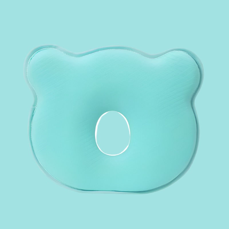 Safe infant memory foam head support pillow for peaceful sleep, aids flat head prevention for newborns.
