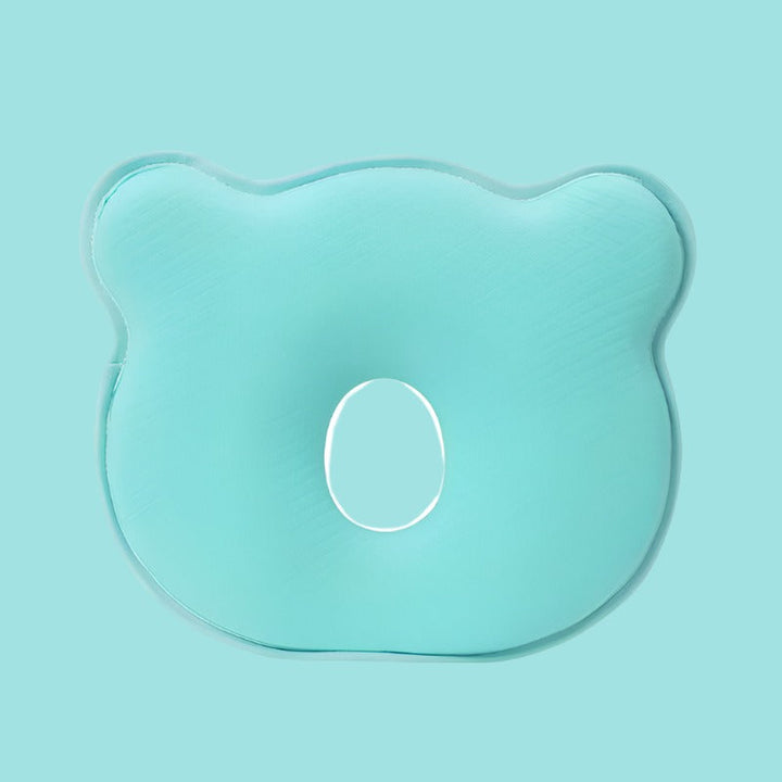 Safe infant memory foam head support pillow for peaceful sleep, aids flat head prevention for newborns.