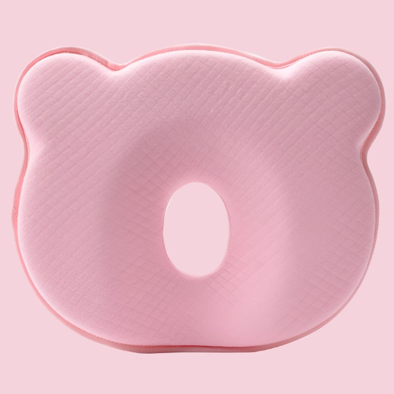 Baby sleep pillow with memory foam for head support, ideal for nursery, aids flat head prevention.