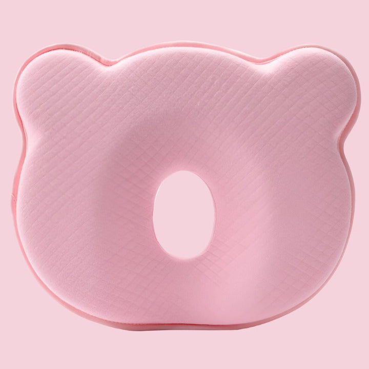 Baby sleep pillow with memory foam for head support, ideal for nursery, aids flat head prevention.