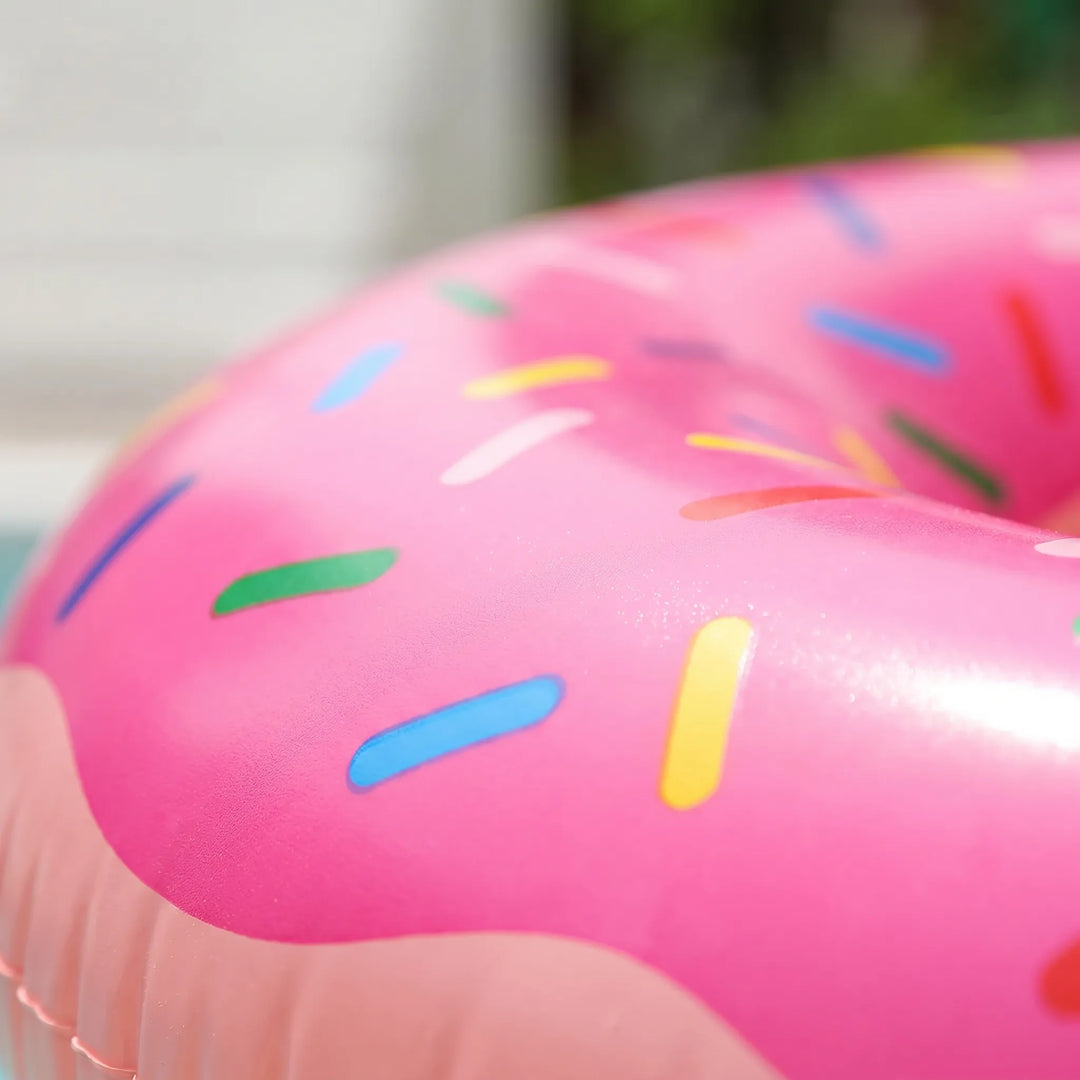 Large inflatable donut-shaped pool float for adults, vibrant design.