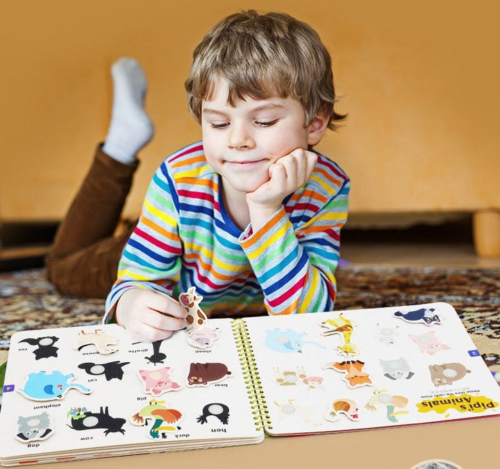 Educational busy book with various activities like zipping, buttoning, and lacing for skill development.