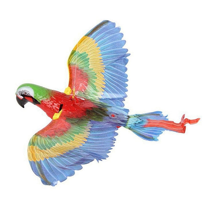 Happy cats playing with the interactive fluttering bird feather toy for exercise.