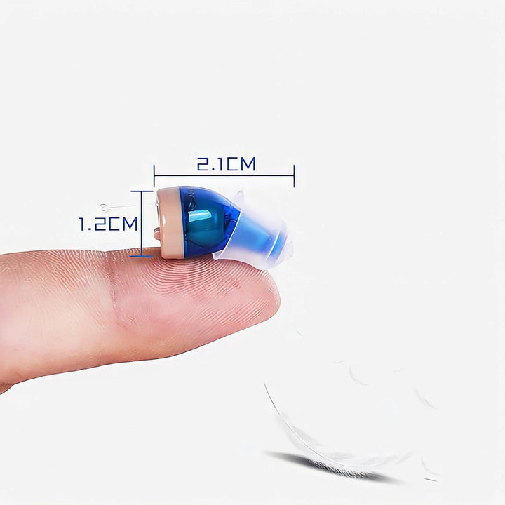 Woman smiling while wearing invisible in-ear hearing aids, discreet SoundComfort audio enhancement