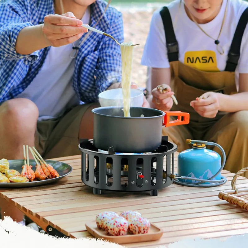 Outdoor cooking with Kael 7-Core portable camping gas stove with convenient igniter