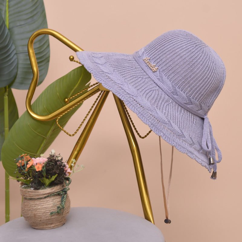 Gray women's breathable beach hat, offering excellent sun protection, ideal for vacations
