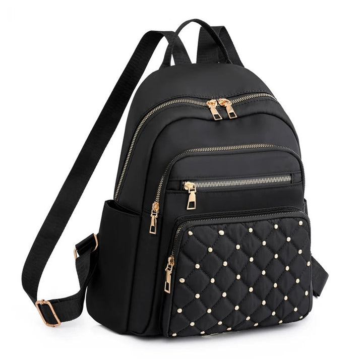 Khaki women's lightweight water-resistant nylon backpack, perfect for daily use, school, or travel.