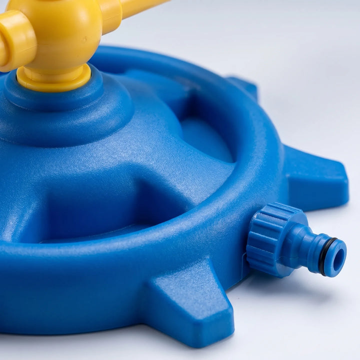 Bright kids' rotating water sprayer creates a backyard water park, ideal for lively summer children activity.
