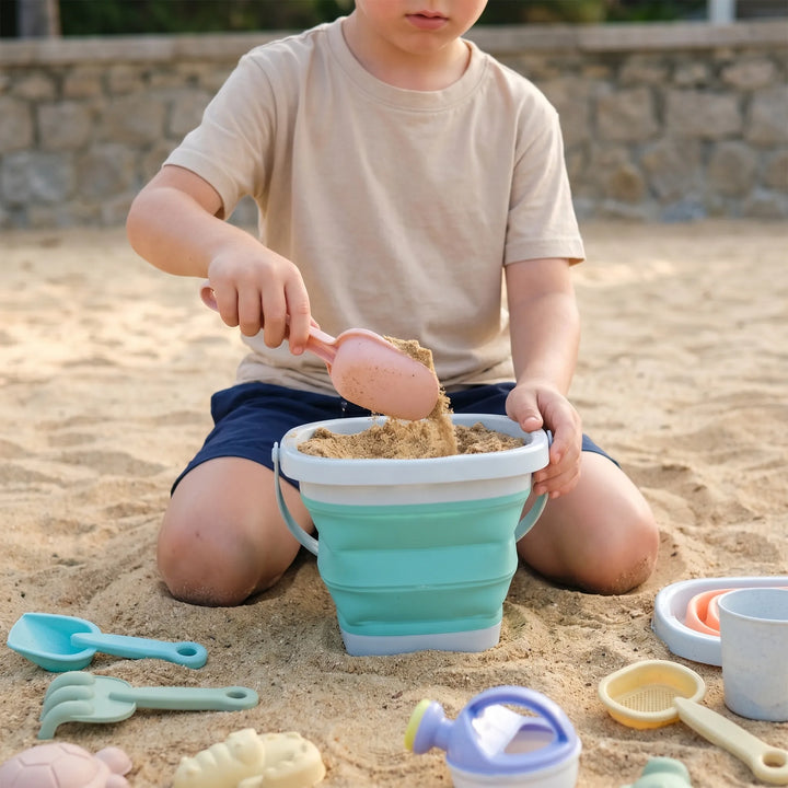 Kids' collapsible beach toy set for sand play, including bucket & shovel. Perfect for easy travel & summer fun.