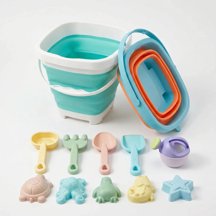 Colorful collapsible sand toy set for kids. Includes bucket, shovel, and molds for beach or outdoor play. Travel-friendly.