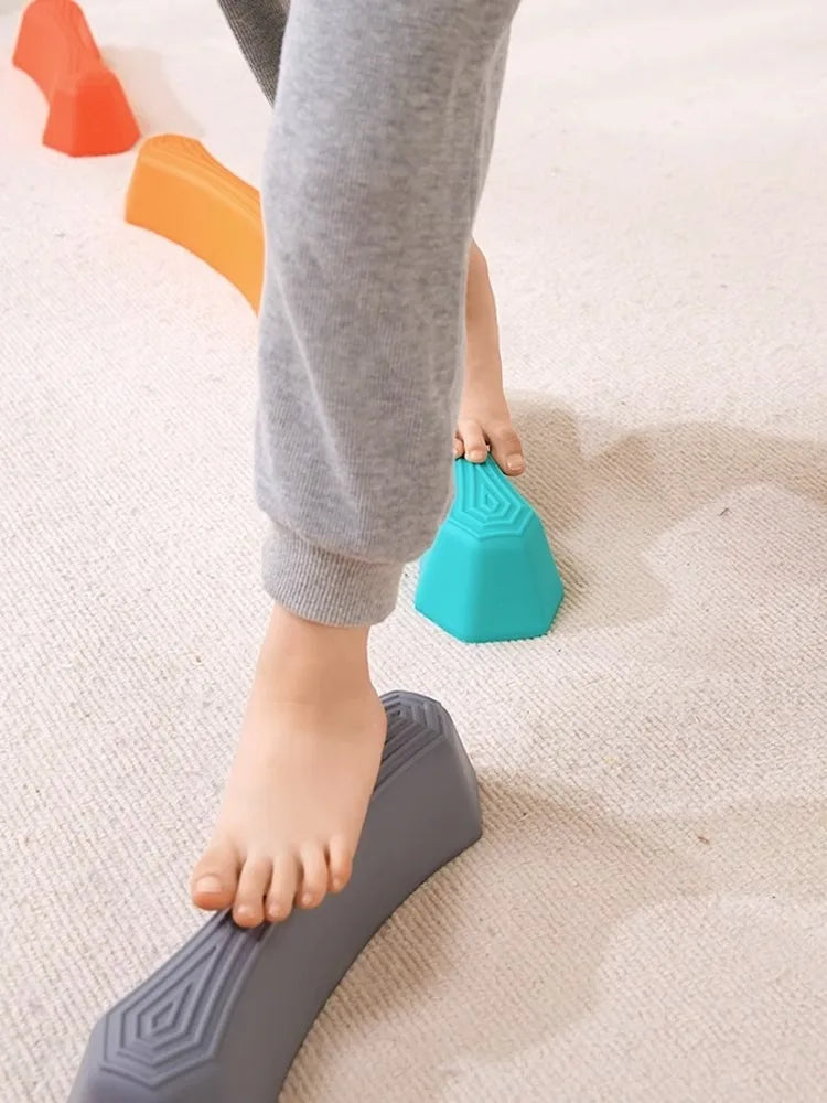 Vibrant plastic balance stepping stones set for children's motor skill development.