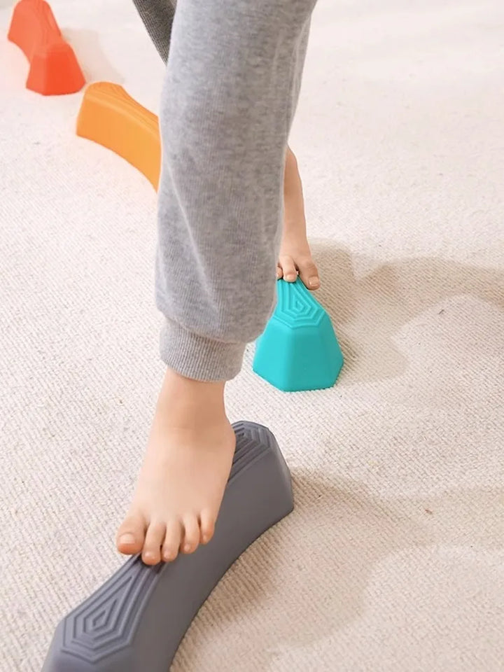 Vibrant plastic balance stepping stones set for children's motor skill development.