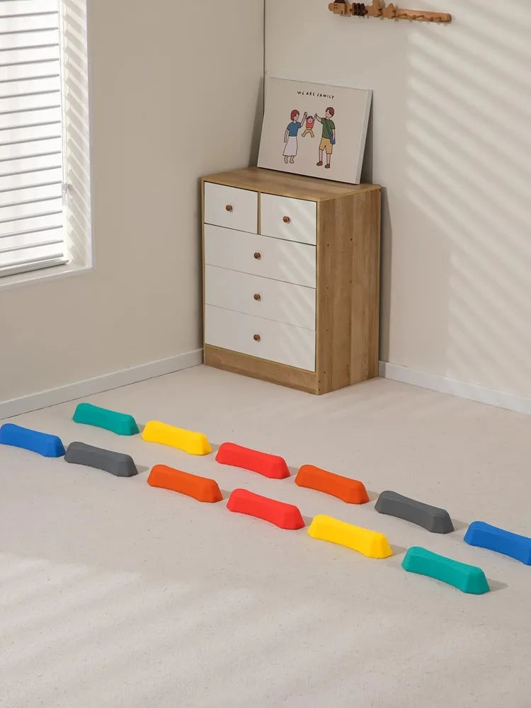 Multi-colored balance stepping stones, ideal for indoor or outdoor active play for kids.