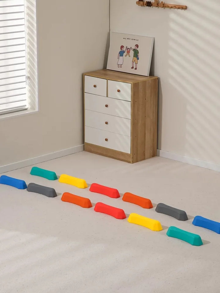 Multi-colored balance stepping stones, ideal for indoor or outdoor active play for kids.