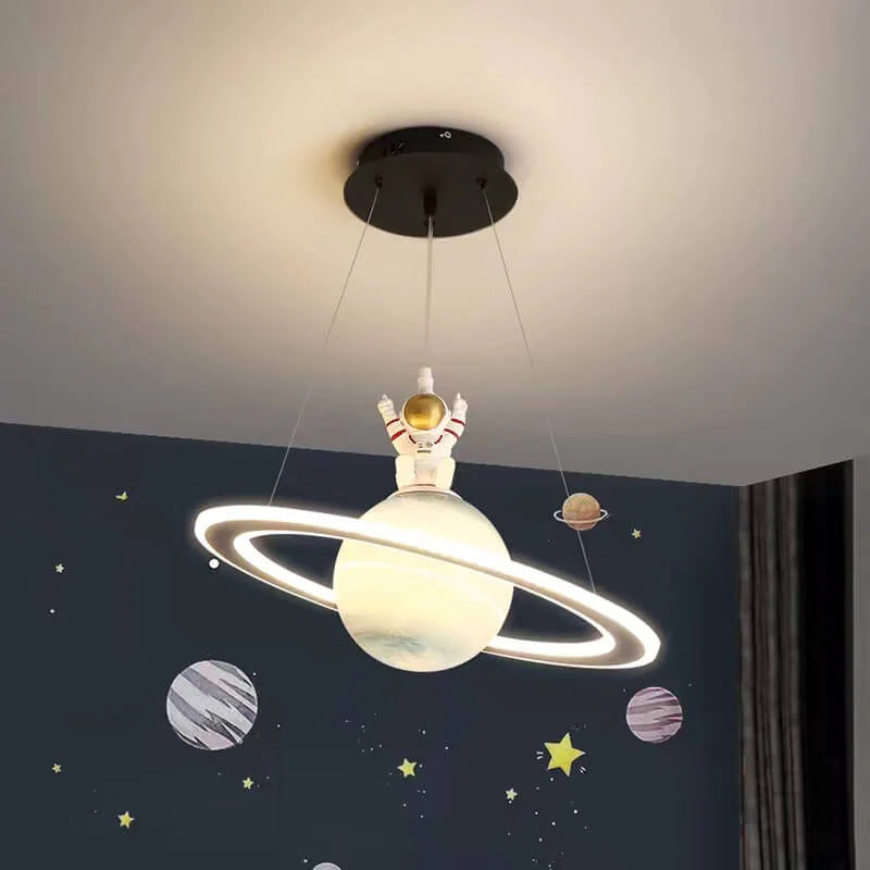 Modern kids' LED pendant light. Cosmic planet design, adjustable ceiling lamp for a space-themed children's room.