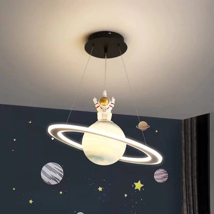 Modern kids' LED pendant light. Cosmic planet design, adjustable ceiling lamp for a space-themed children's room.