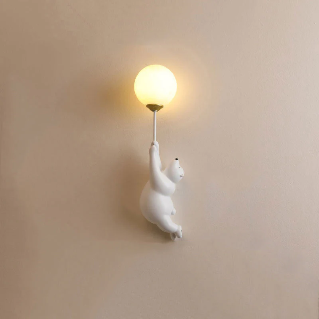 Adorable resin bear LED wall light, ideal for charming kids' bedroom or nursery ambiance.