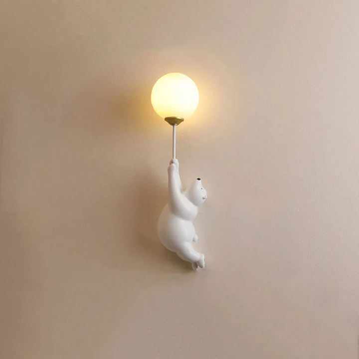 Adorable resin bear LED wall light, ideal for charming kids' bedroom or nursery ambiance.