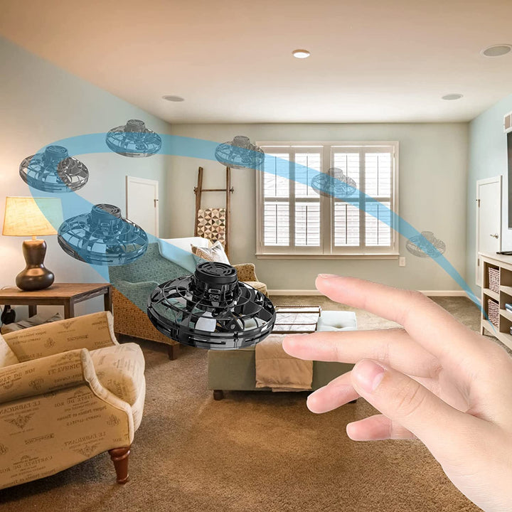 Child flying a futuristic hand-controlled UFO drone, ideal kids' toy for boys & girls, rechargeable.