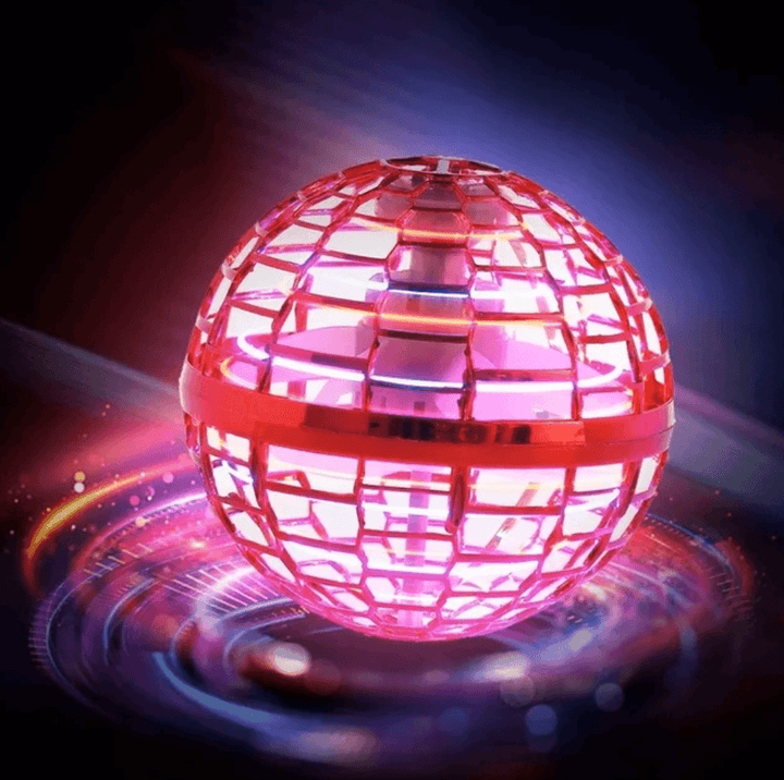 The LED Boomerang Orb Flying Toy Sphere held in a child's hand, illustrating its compact size.