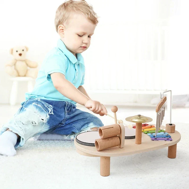 Toddler happily playing MelodyMaker Creative Music Station, exploring sounds & melodies, an engaging musical educational toy.