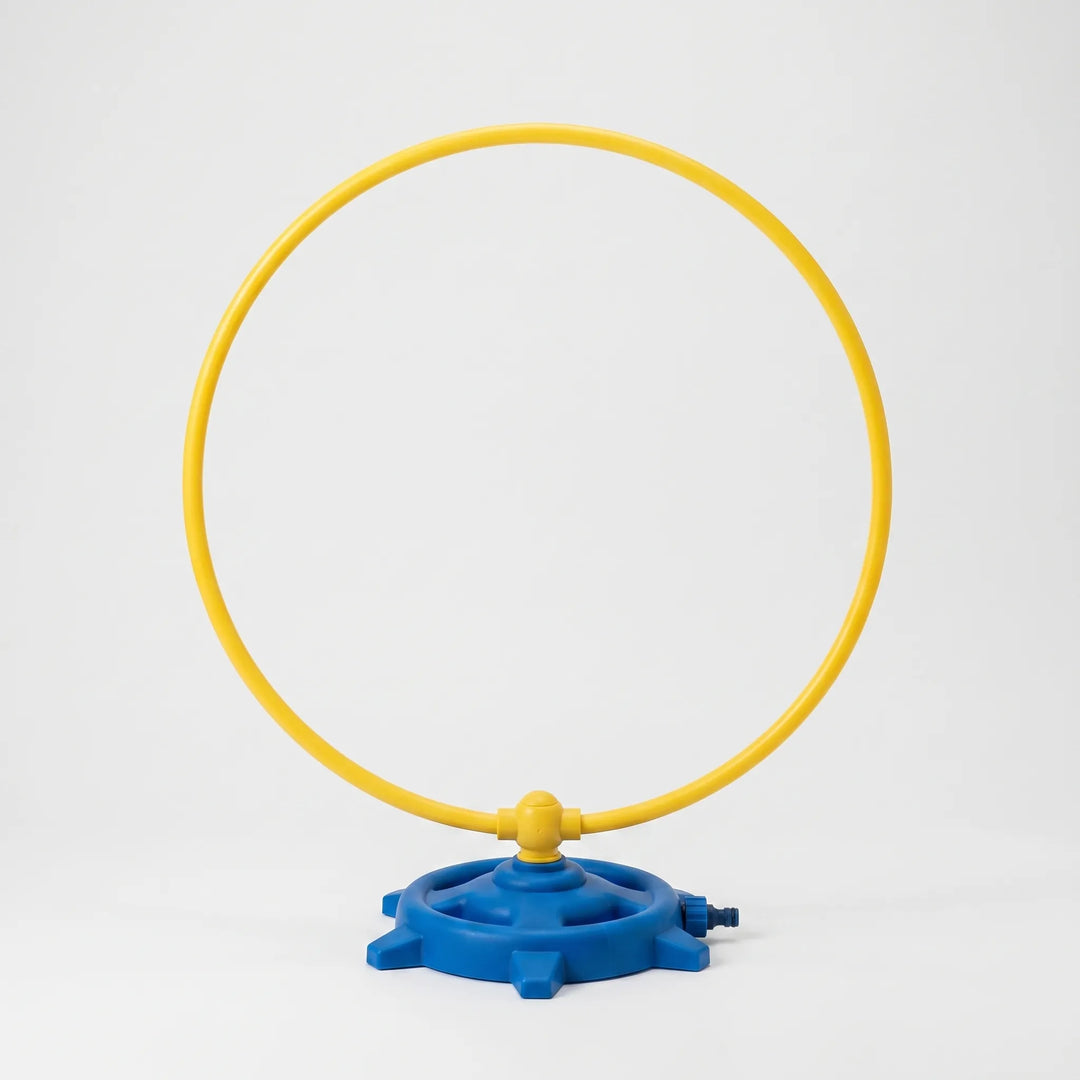 Colorful rotating water sprinkler for kids, ideal for outdoor summer playtime and refreshing water fun.