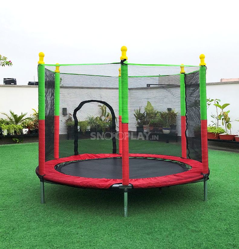 Children's trampoline featuring a secure safety net, ensuring safe outdoor play and active fun in the garden.