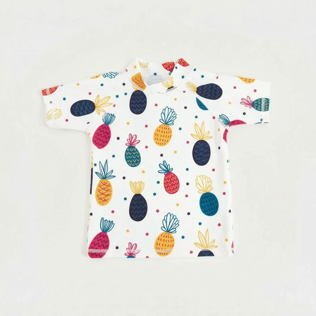 Close-up of quick-dry fabric on kids' short-sleeve rash guard for UPF 50+ beach protection.
