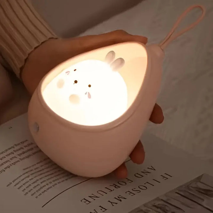 Animal-shaped LED night light for kids' bedroom, rechargeable, with automatic motion sensor.